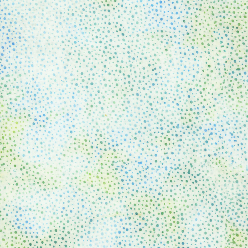 white fabric with a pattern of green and blue dots on a mottled background.