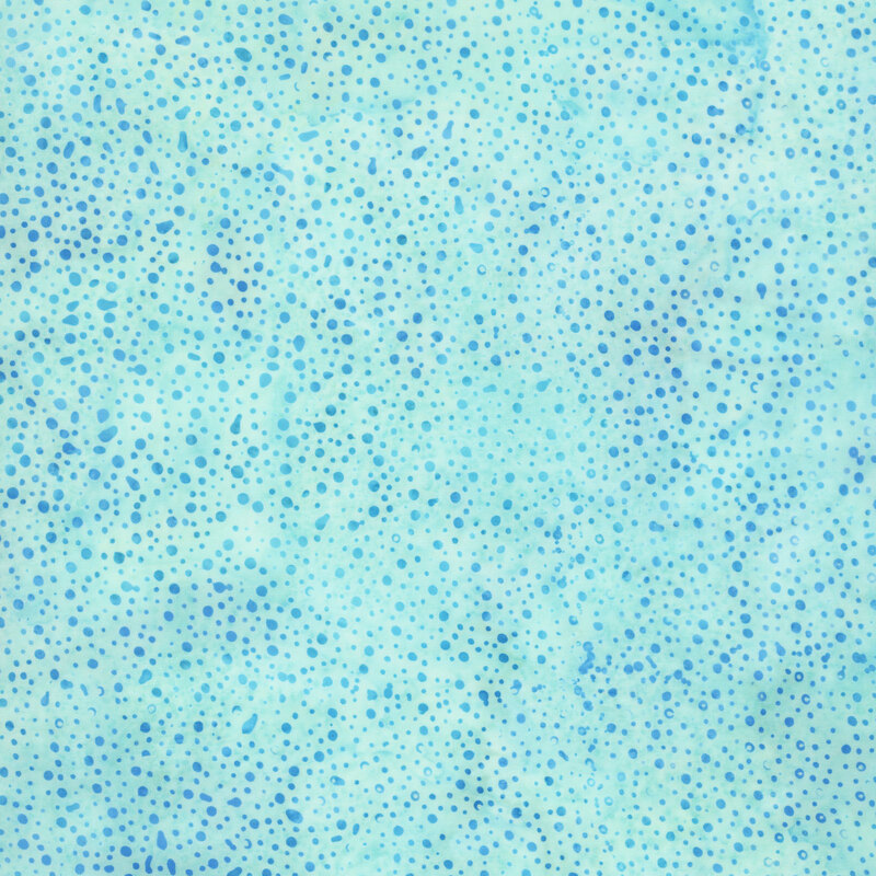 Swatch of aqua blue tonal batik with mottling and irregular blue dots.