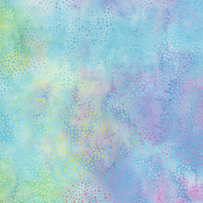 rainbow colored fabric with a pattern of colorful dots on a mottled background.