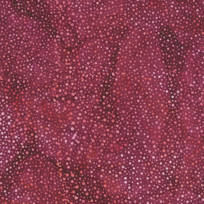 violet fabric with a pattern of dots on a mottled background.