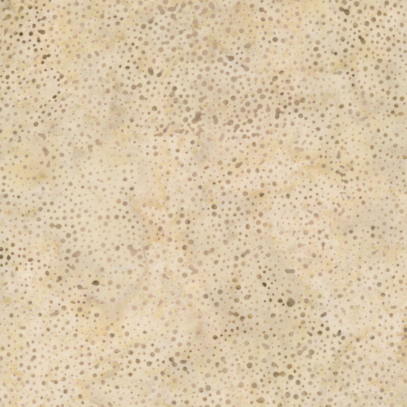 tan fabric with a pattern of dots on a mottled background.