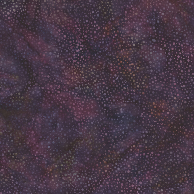 purple fabric with a pattern of dots on a mottled background.