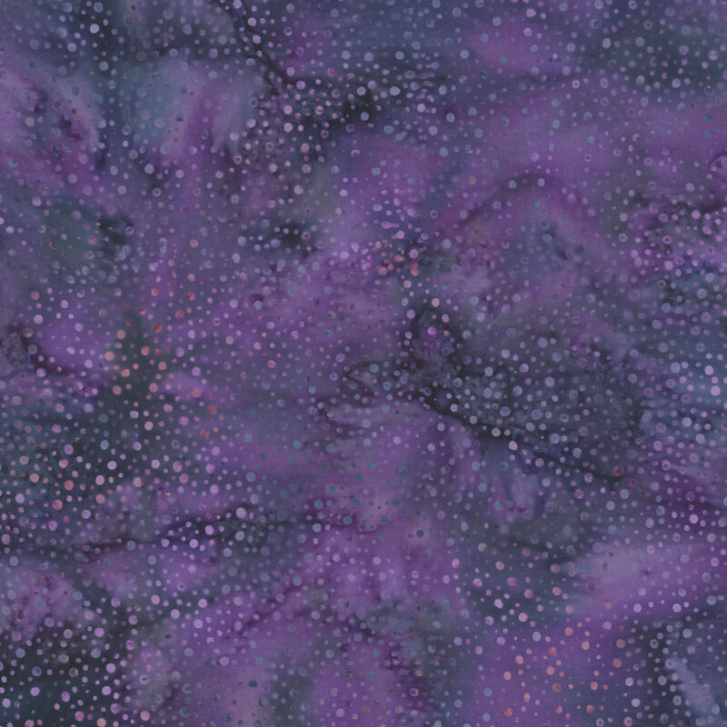 purple fabric with a pattern of dots on a mottled background.