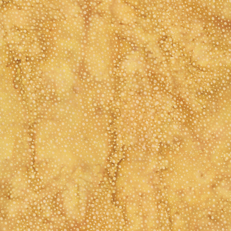 yellow fabric with a pattern of tonal dots on a mottled background.