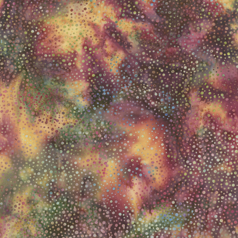 warm and colorful fabric with a pattern of dots on a mottled background.