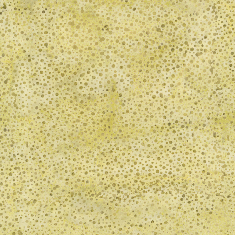 olive yellow fabric with a pattern of dots on a mottled background.