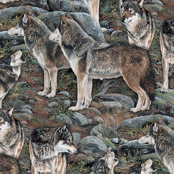 Fabric with a large wolf pack strewn across a rocky landscape.