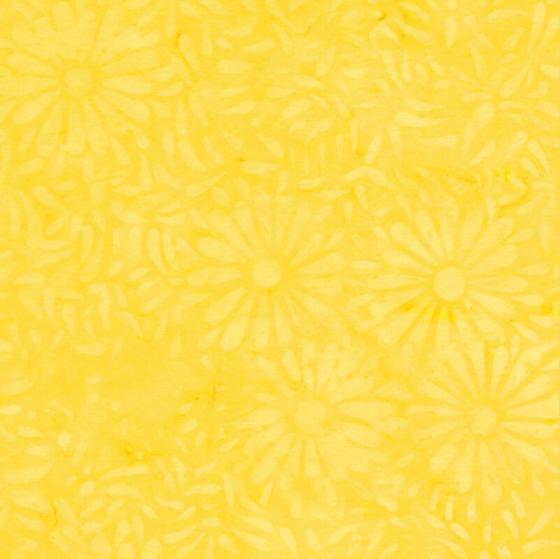 Yellow batik featuring a repeating daisy petal motif.