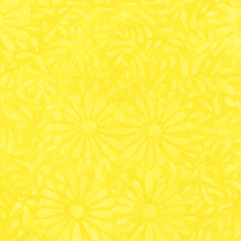 Yellow batik featuring a repeating daisy petal motif.