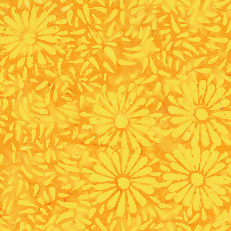 Orange yellow batik featuring a repeating daisy petal motif.