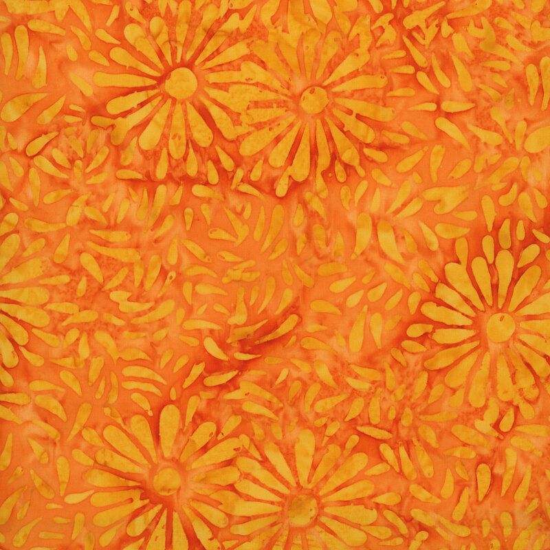 Orange batik featuring a repeating daisy petal motif.