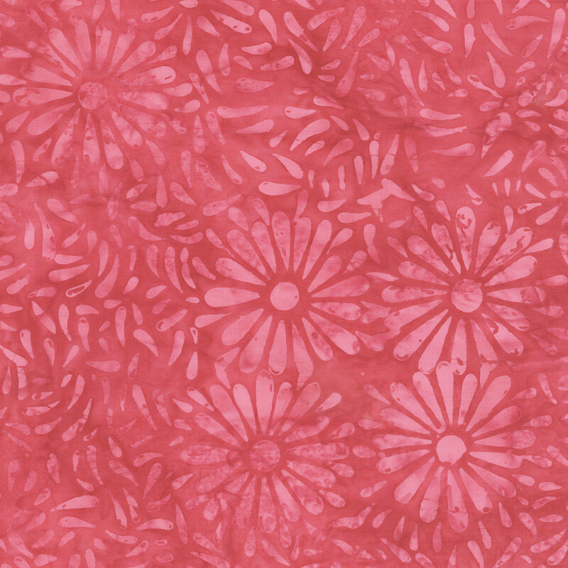 Pink batik featuring a repeating daisy petal motif.