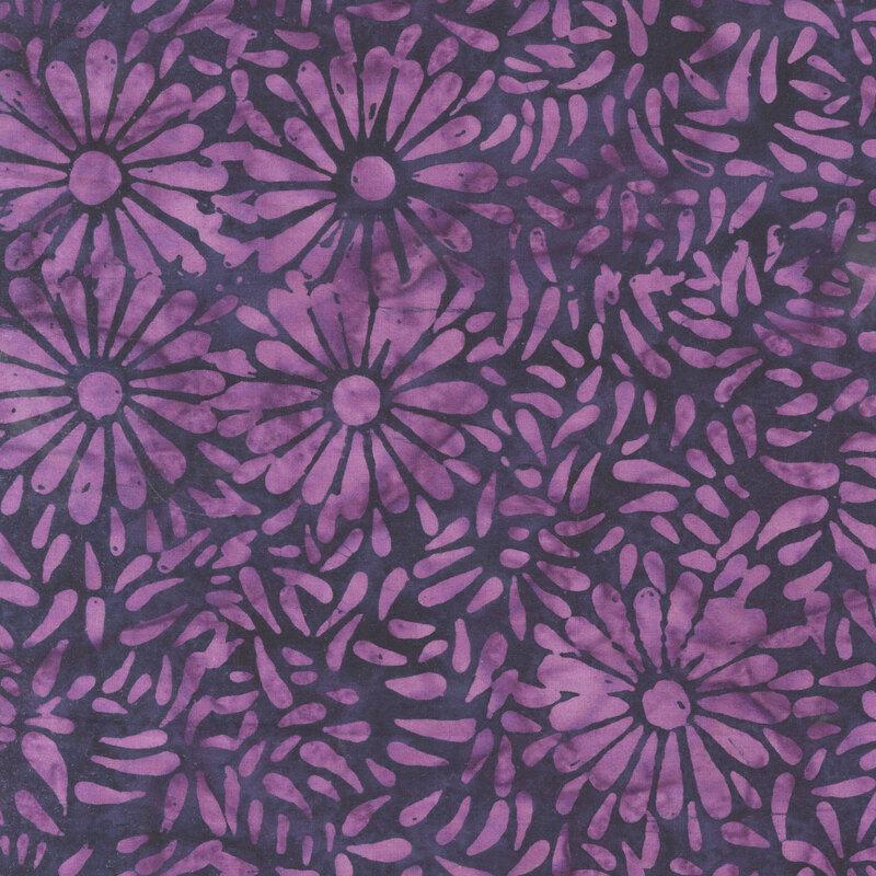 Contrasting purple batik featuring a repeating daisy petal motif.