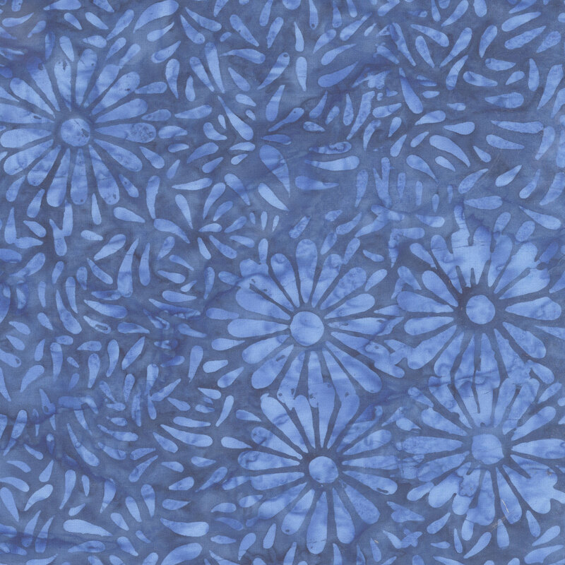 Blue batik featuring a repeating daisy petal motif.