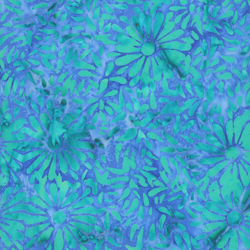 Vibrant blue batik featuring a repeating daisy petal motif.