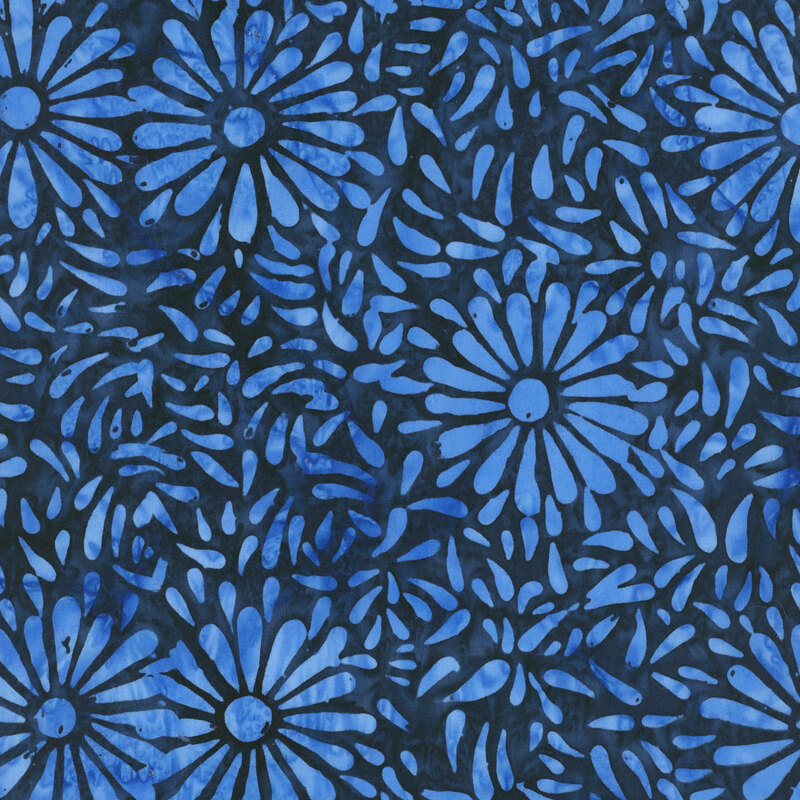 Dark blue batik featuring a repeating vibrant iris daisy petal motif.