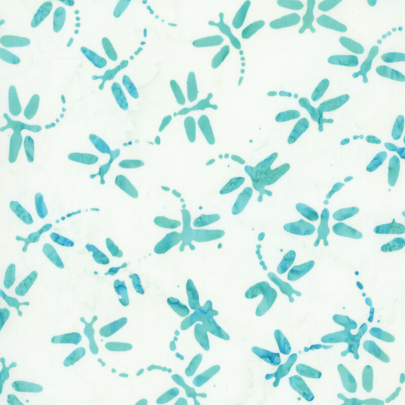 Cream and turquoise batik with dragon flies scattered throughout the fabric.