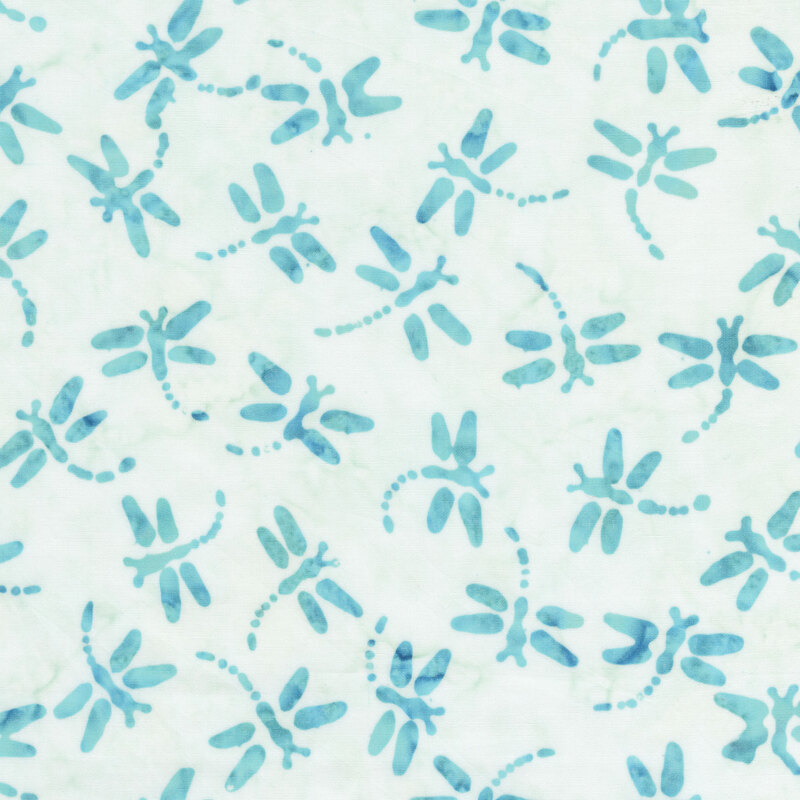 Cream and turquoise batik with dragon flies scattered throughout the fabric.