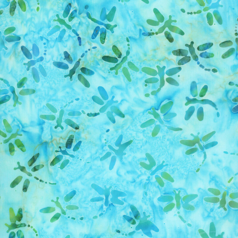 Ocean blue and turquoise batik with overprinted dragonflies scattered throughout the fabric.