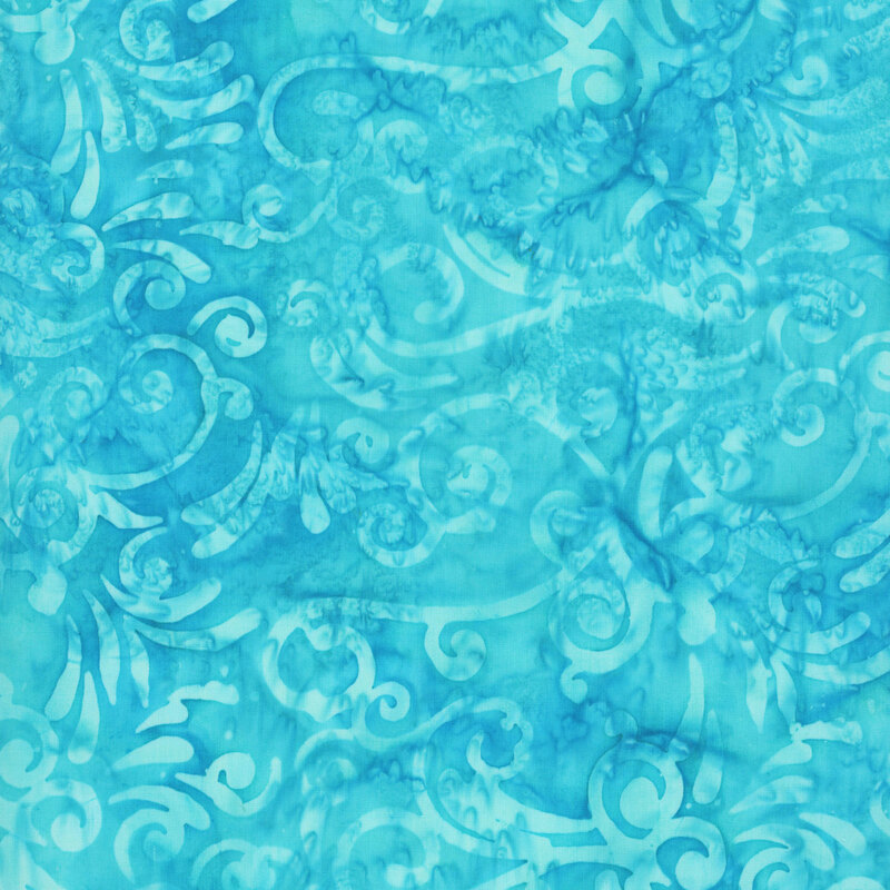 Peacock blue batik with tonal scrolling swirls.
