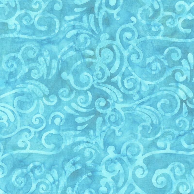 Peacock blue batik with tonal scrolling swirls.