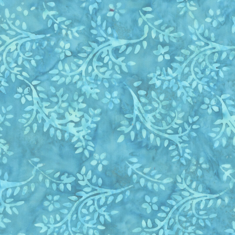 Turquoise tonal batik featuring vines and leaves wrapped around the fabric.