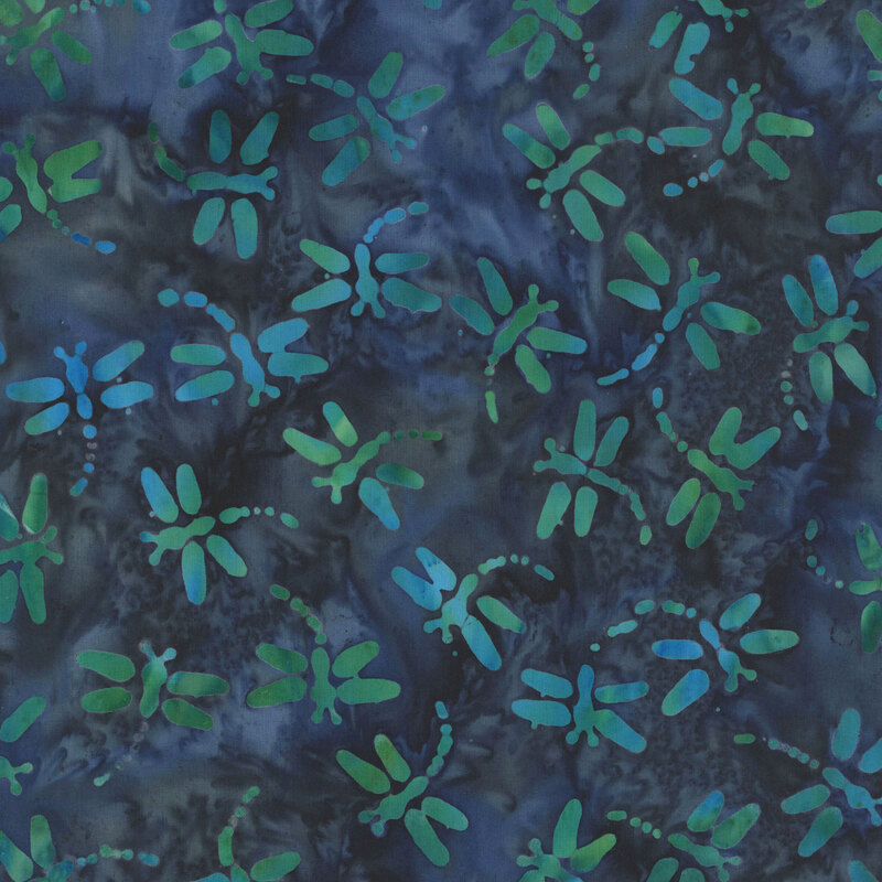 Navy and teal batik with dragonflies scattered throughout the fabric.