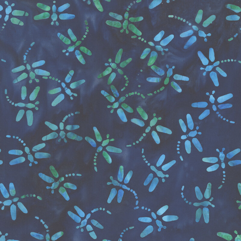 Navy and teal batik with dragonflies scattered throughout the fabric.