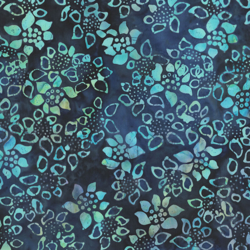 Navy batik fabric packed with flower and petal motifs.
