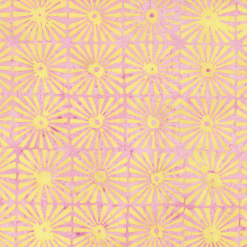 Faded bubblegum pink batik fabric featuring grids of yellow sunburst motifs.