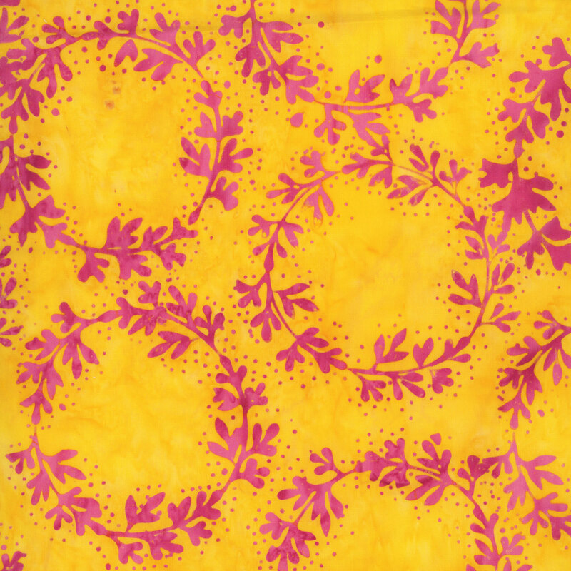 Mottled golden yellow batik fabric featuring rings of magenta vines with dotted accents.