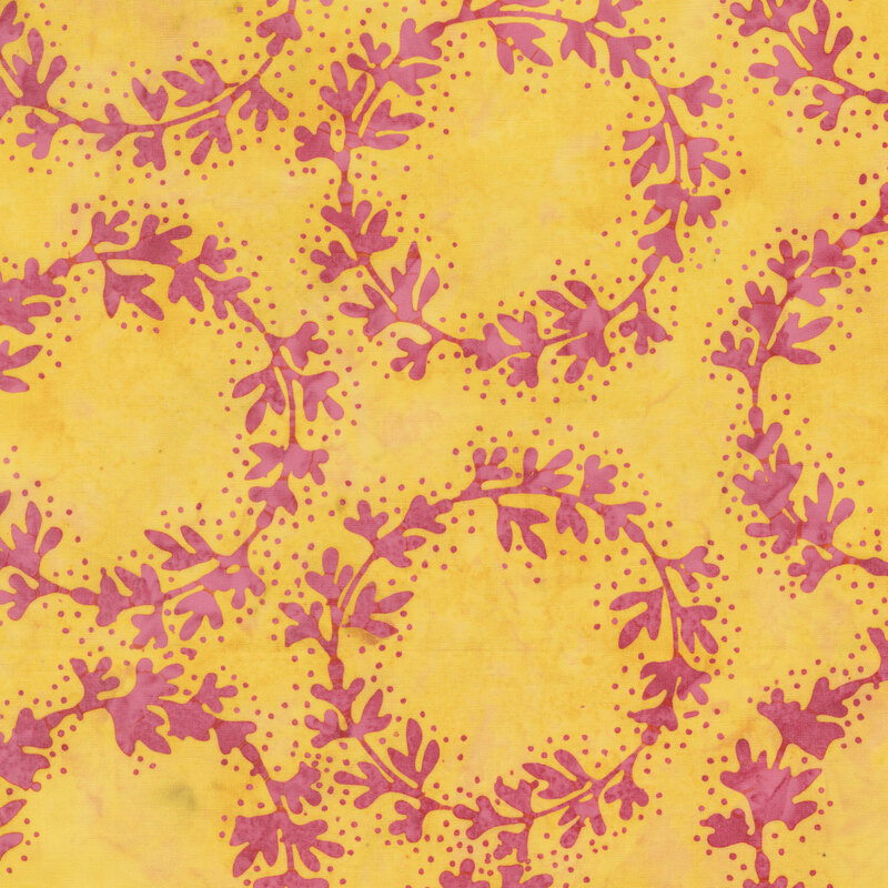 Mottled golden yellow batik fabric featuring rings of magenta vines with dotted accents.