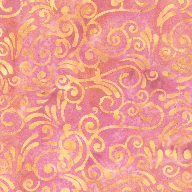 Mottled pink fabric with an ocher and pale yellow scroll print.