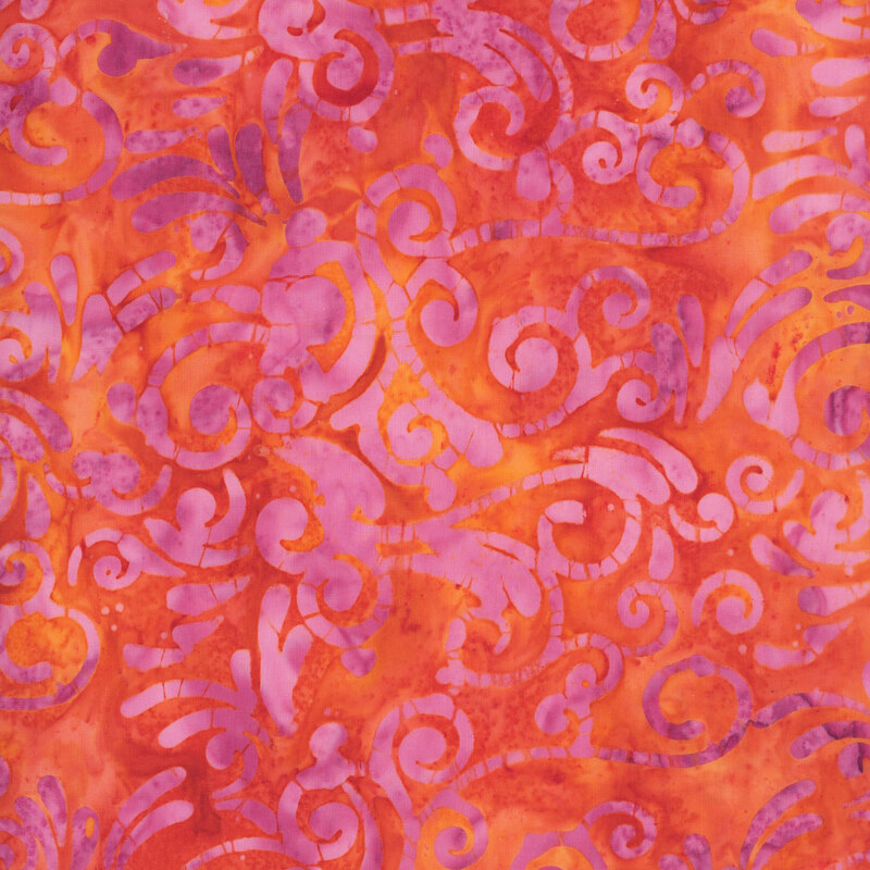 Mottled orange fabric with a pale pink scroll print.