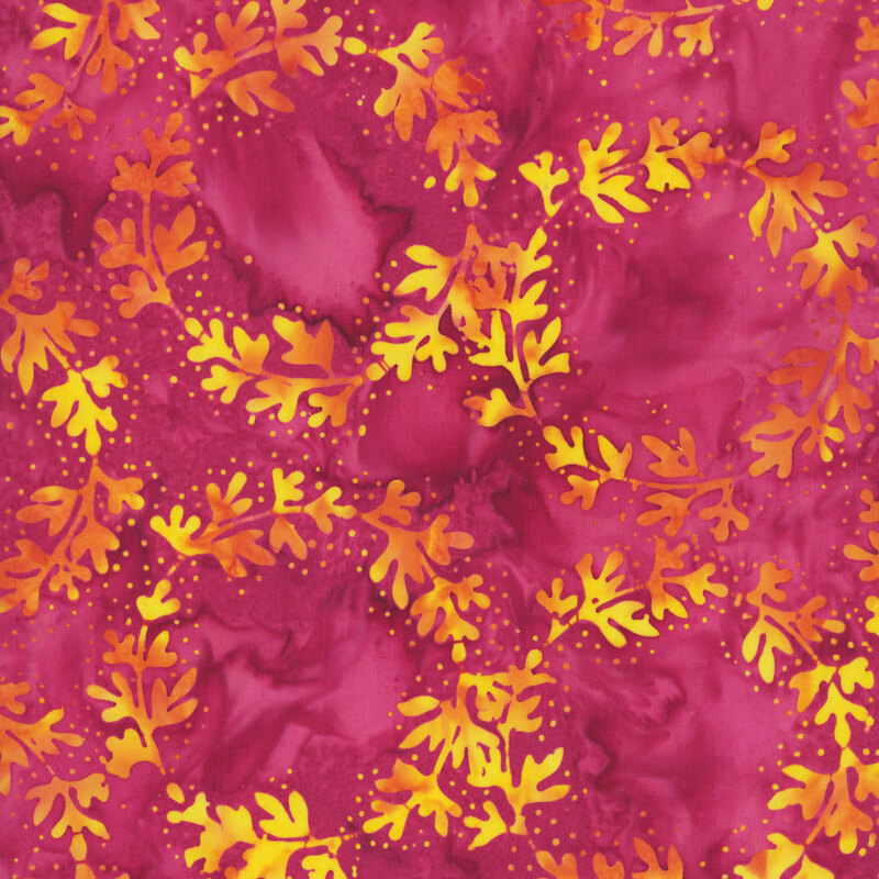 Mottled magenta red fabric featuring rings of leafy vines with dotted accents in golden orange hues.