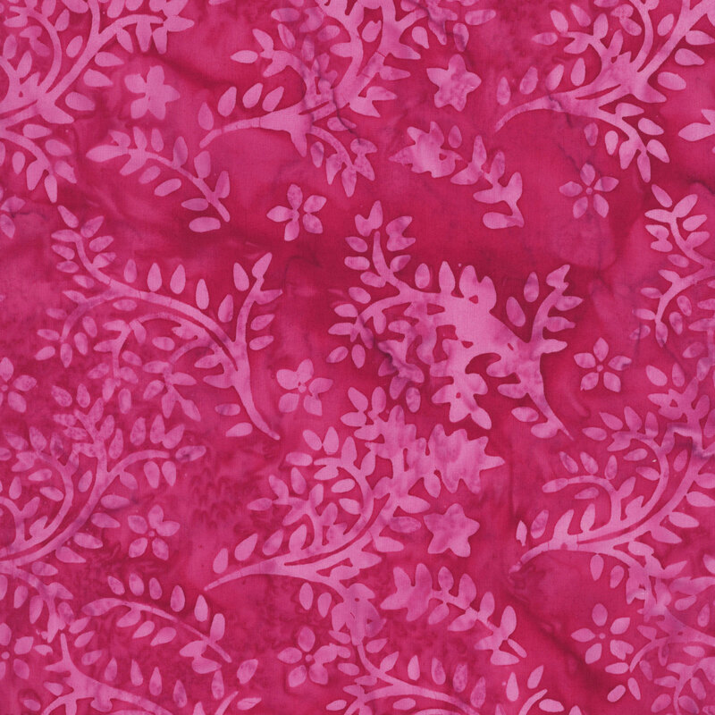 Mottled magenta red fabric featuring a tossed vine and leaf pattern in soft orchid hues.