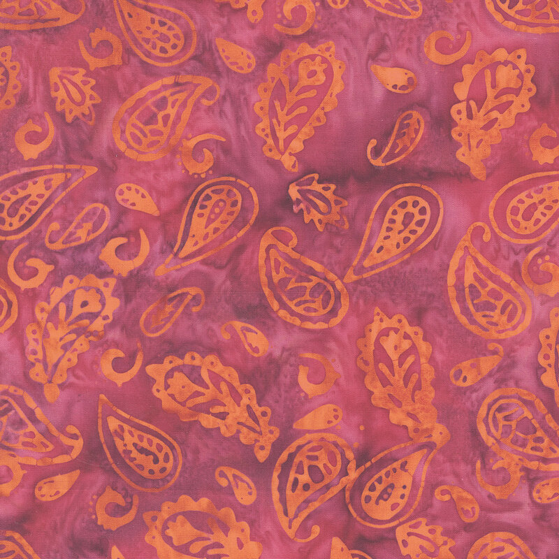 Orange paisley motifs tossed on a mottled sangria background.