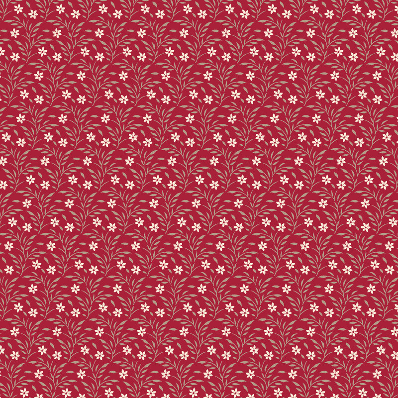 Red fabric with cream and beige vines and florals.