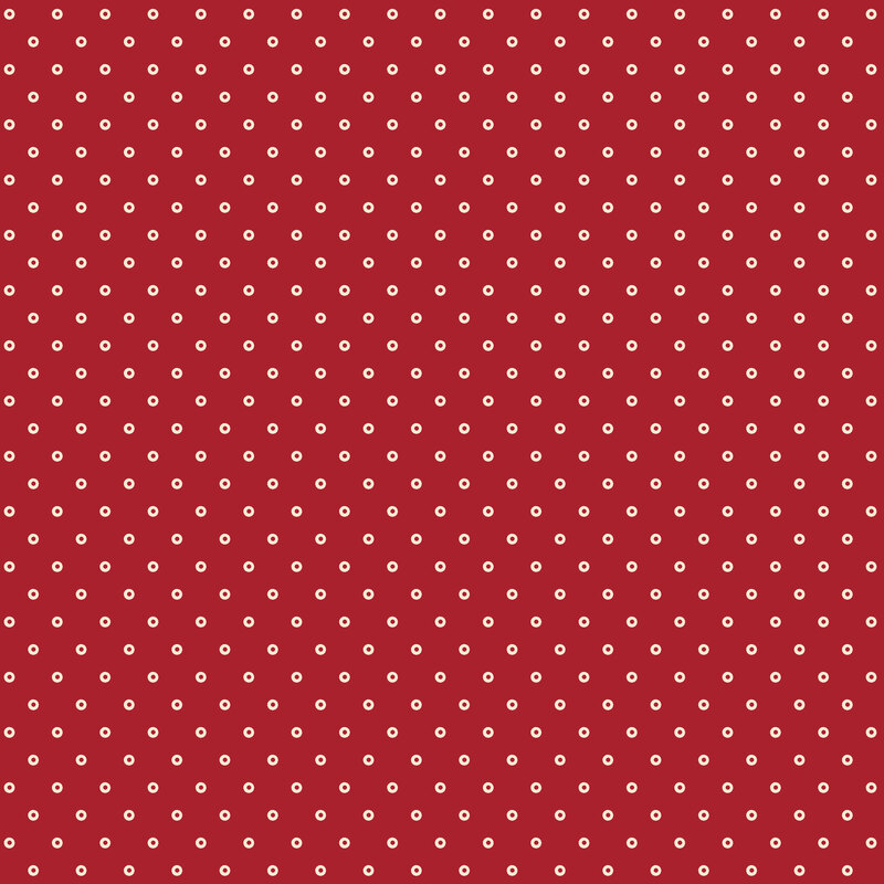 Red fabric with a cream hollow polka dot pattern.