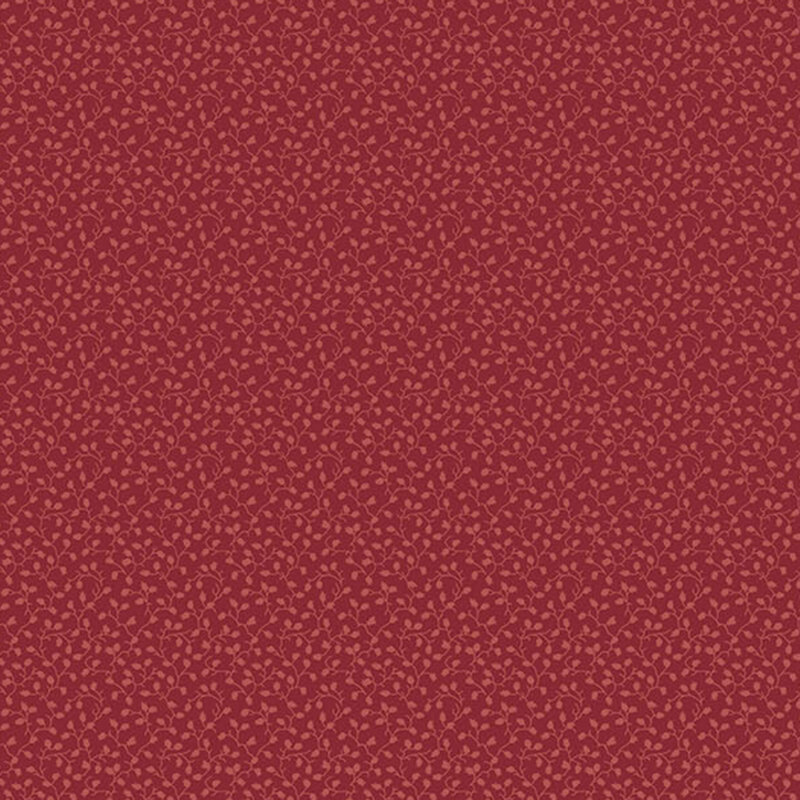 tonal crimson fabric featuring a vine print with tiny leaves and budding sprigs.