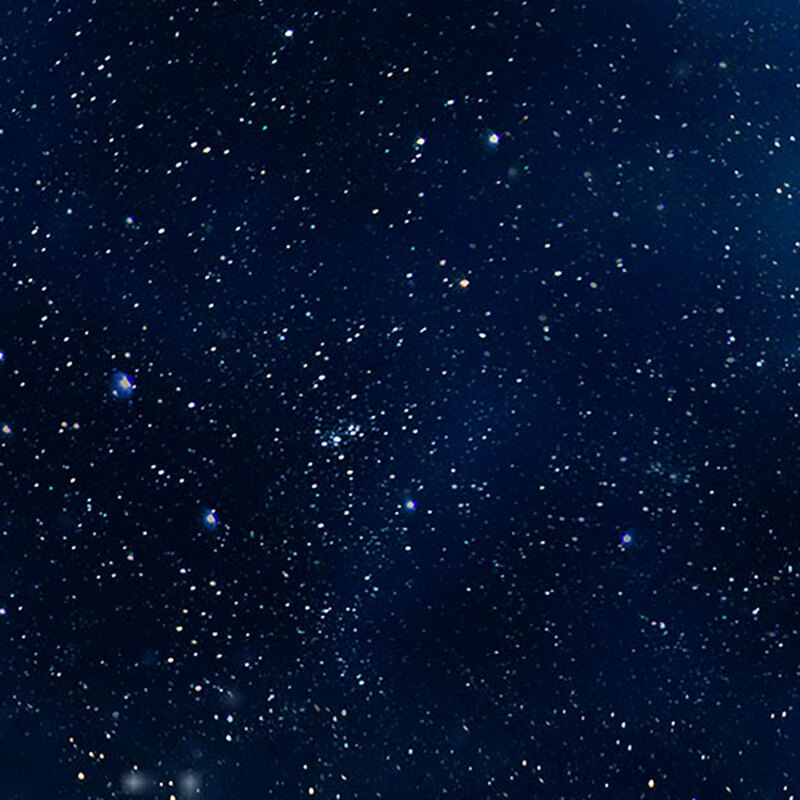 Deep blue fabric with shining stars in the night sky.