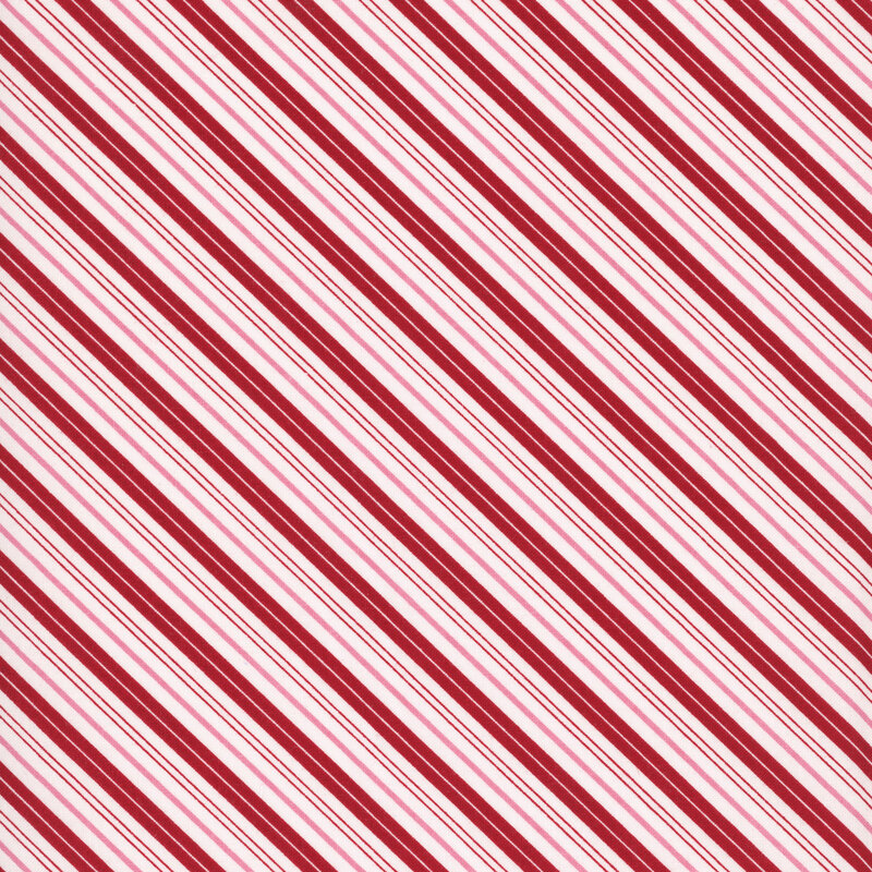Red, pink, and white candy cane striped fabric.