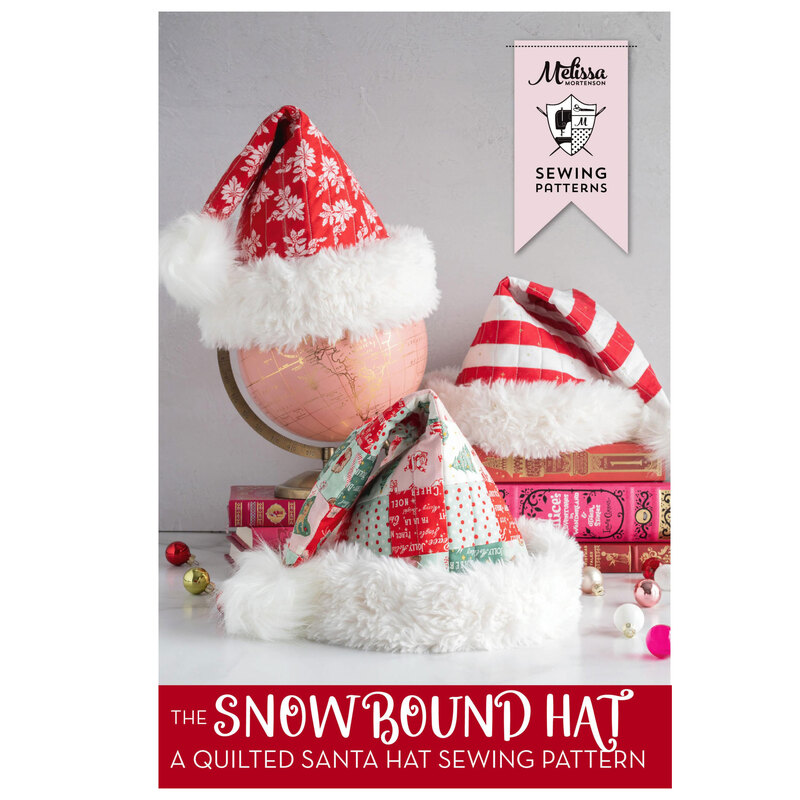 Front image of the pattern featuring the 3 finished santa hats staged with a globe and books.