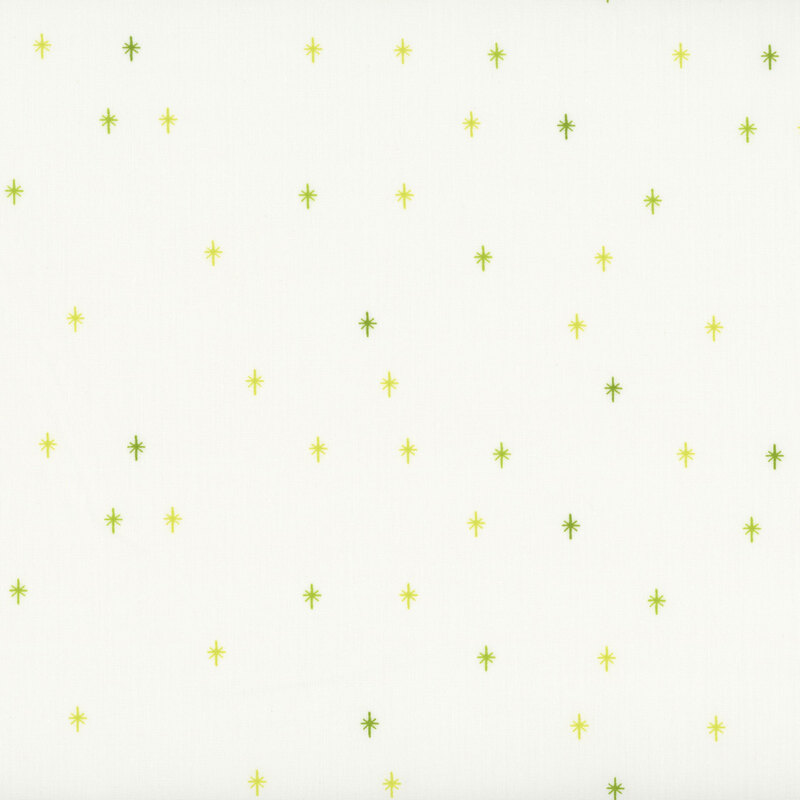 This cream fabric features a leaf green design of scattered sparkles, adding a playful and magical touch to your projects.