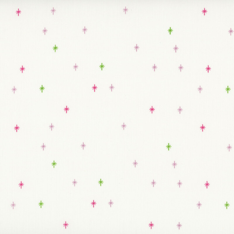 This cream fabric features a green and pink design of scattered sparkles, adding a playful and magical touch to your projects.