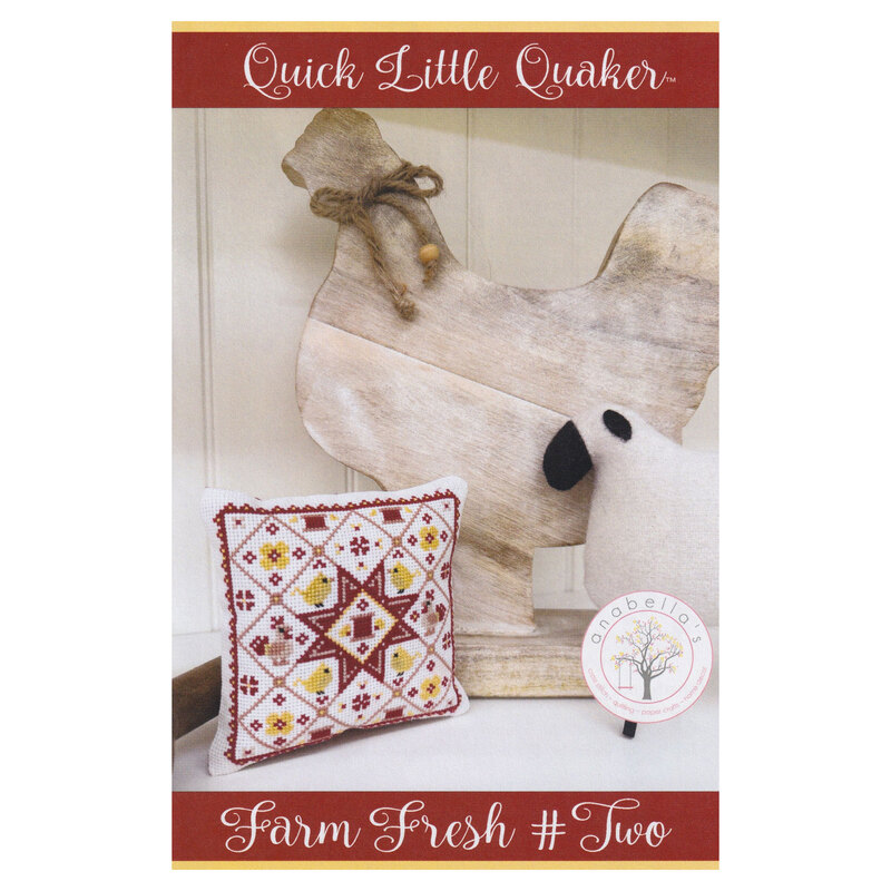 Front cover of the pattern featuring the completed design made into a pillow, staged with chicken and sheep décor.