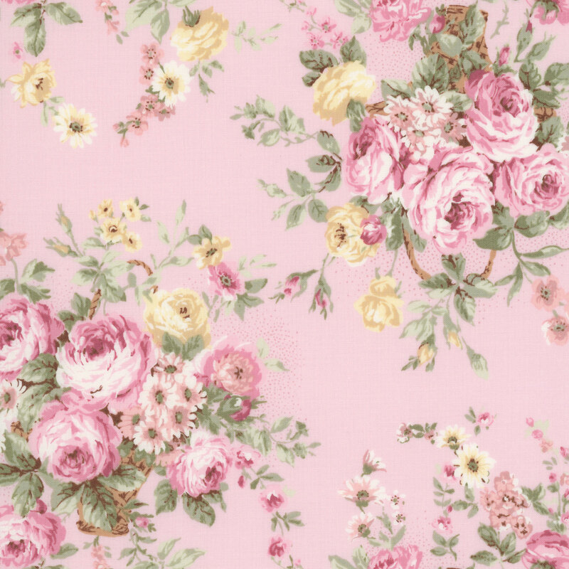 Soft pink fabric with bunches of yellow and pink roses.