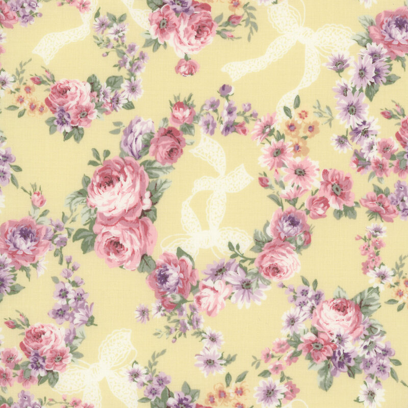 Soft yellow fabric with white bows and wreaths of florals and mauve-pink roses.