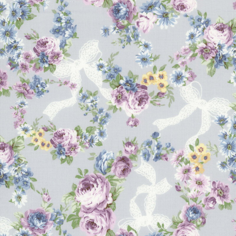 Gray-blue fabric with white bows and wreaths of florals and heather purple roses.