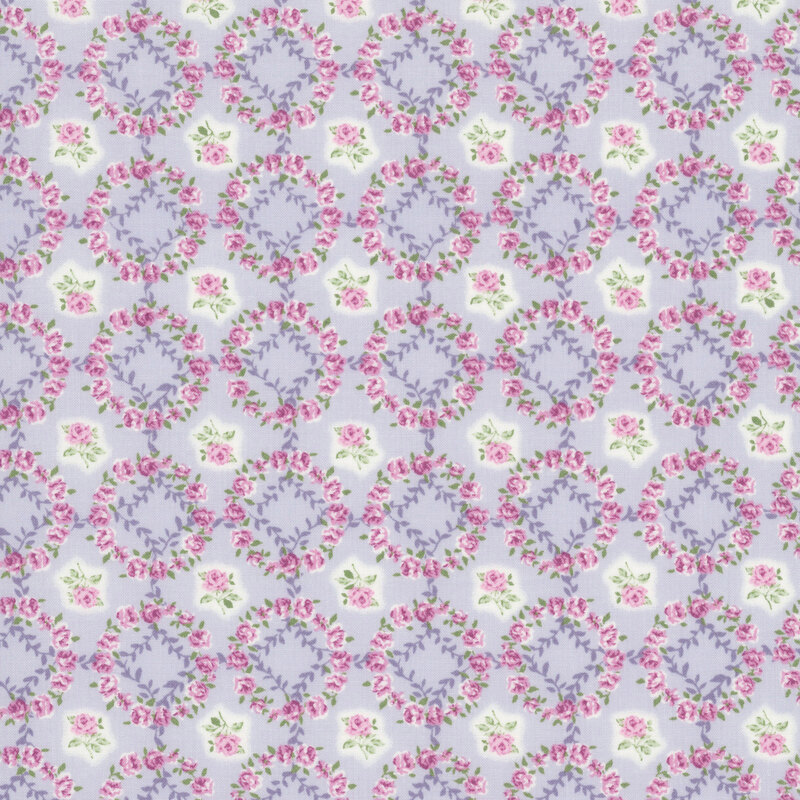 lavender fabric layered with a grid of mauve-pink rose wreaths and roses.